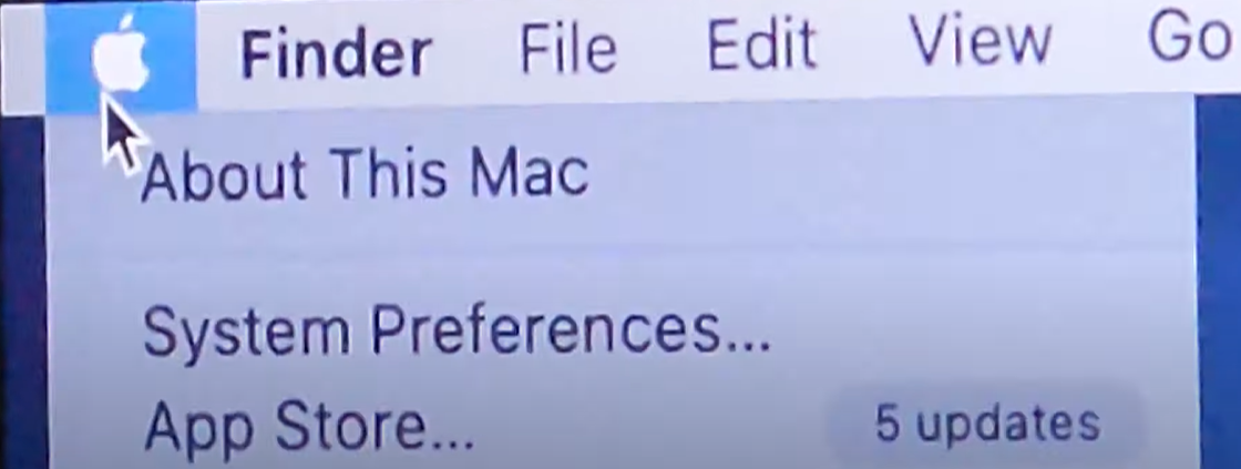 To select system preference option in MacBook Apple mneu