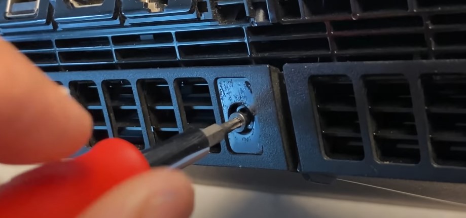 removing screw on the backside of PS4.