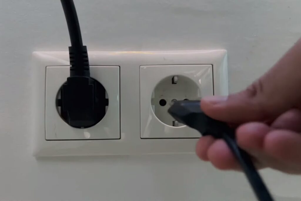Image showing to Turn off the power by removing the cord 
