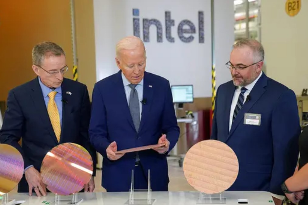Even though Biden administered the CHIPS Act, Intel has now amended the terms of the original deal to access .7B sooner than planned for a total investment of .1B as of yet. (Image Credits - Kevin Lamarque, Reuters)